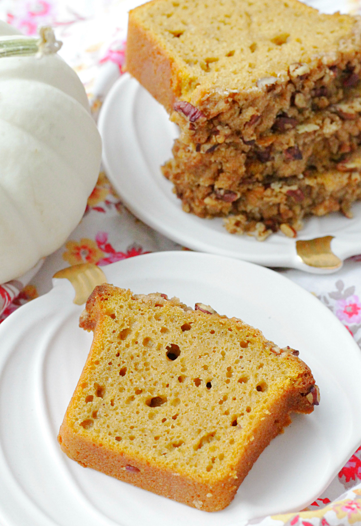 slice of really good pumpkin bread on pumpkin ceramic plate