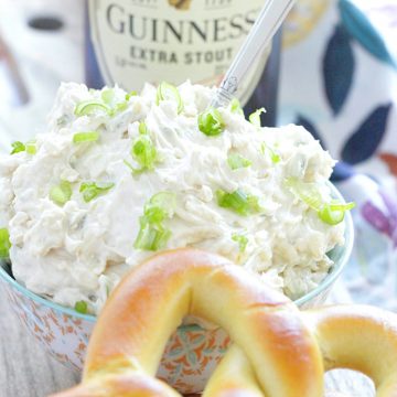 guinness cheddar dip pictured with a bottle of Guinness