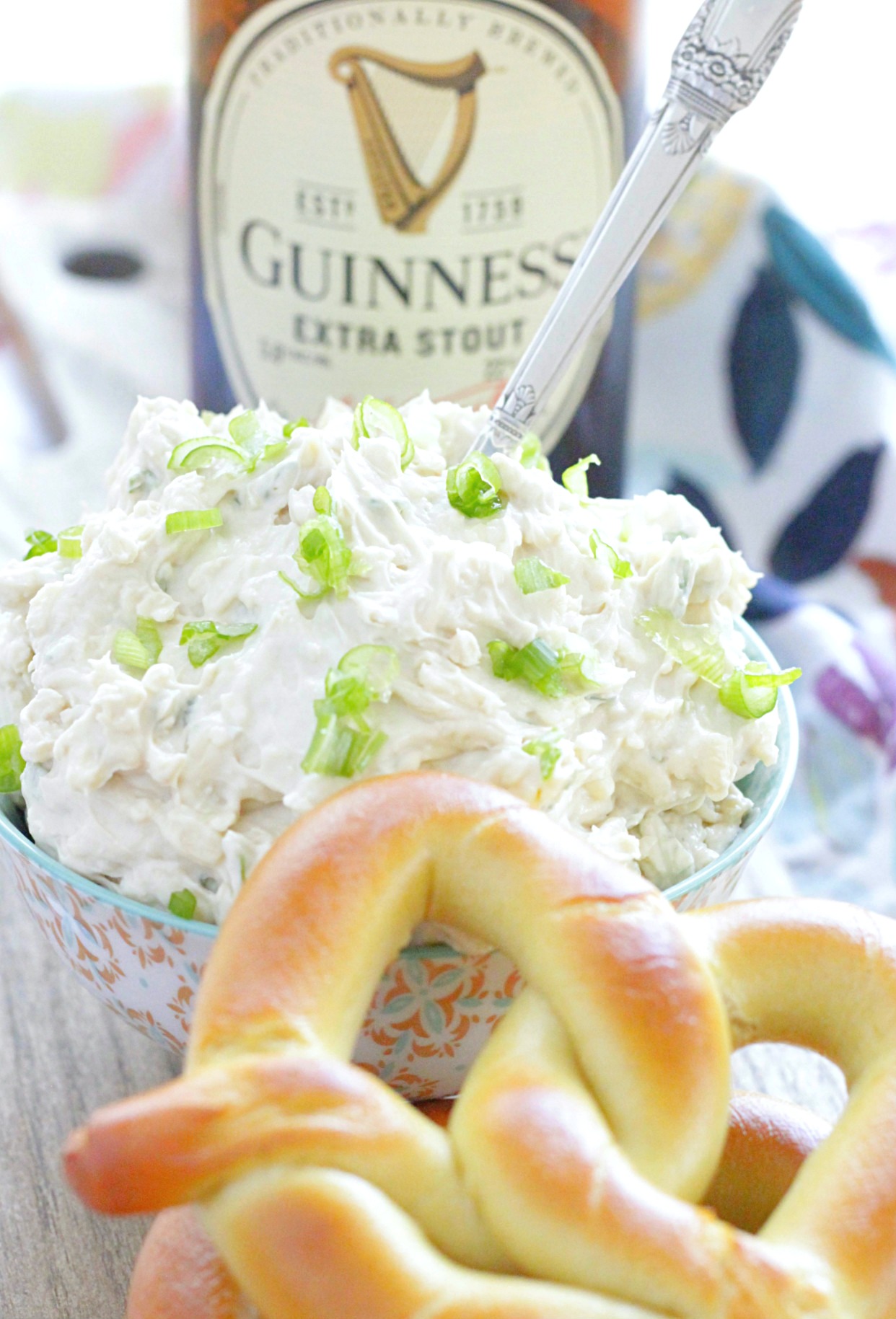 guinness cheddar dip pictured with a bottle of Guinness