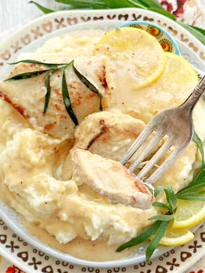 taking a bite of chicken tarragon