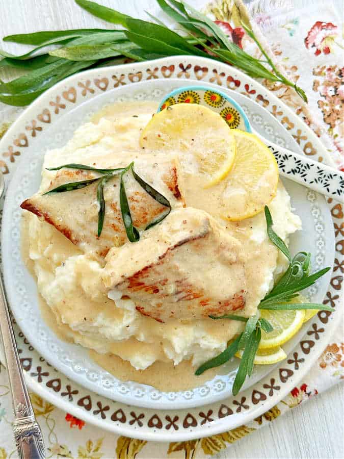 chicken tarragon plated with mashed potatoes