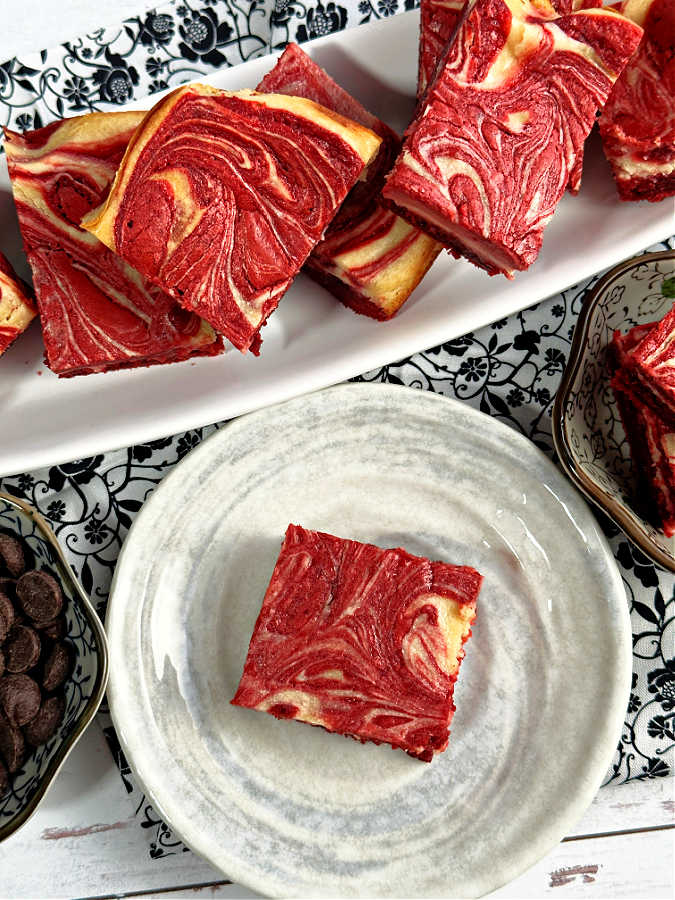 red velvet cheese brownies sliced into squares and plated