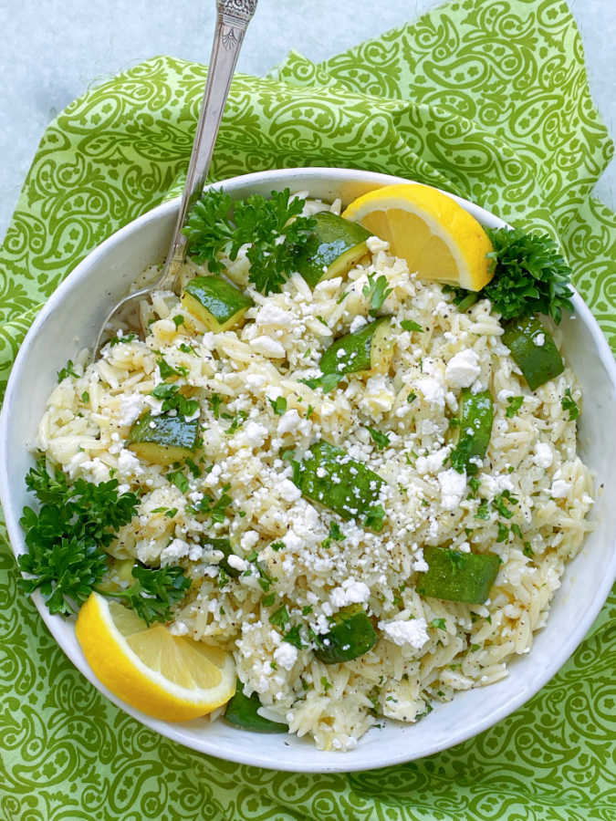 a big bowl of orzo pasta salad ready to serve