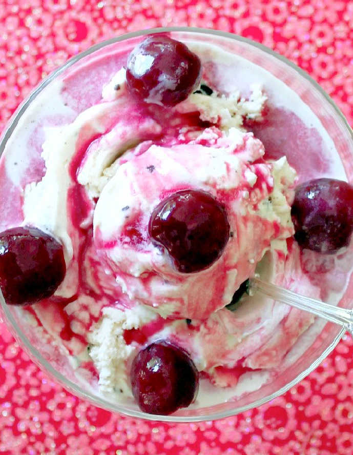 cherry sundae with Graeter's Coconut Chip Ice Cream topped with maraschino cherries