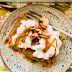 a slice of pumpkin pie baked oatmeal topped with whipped cream