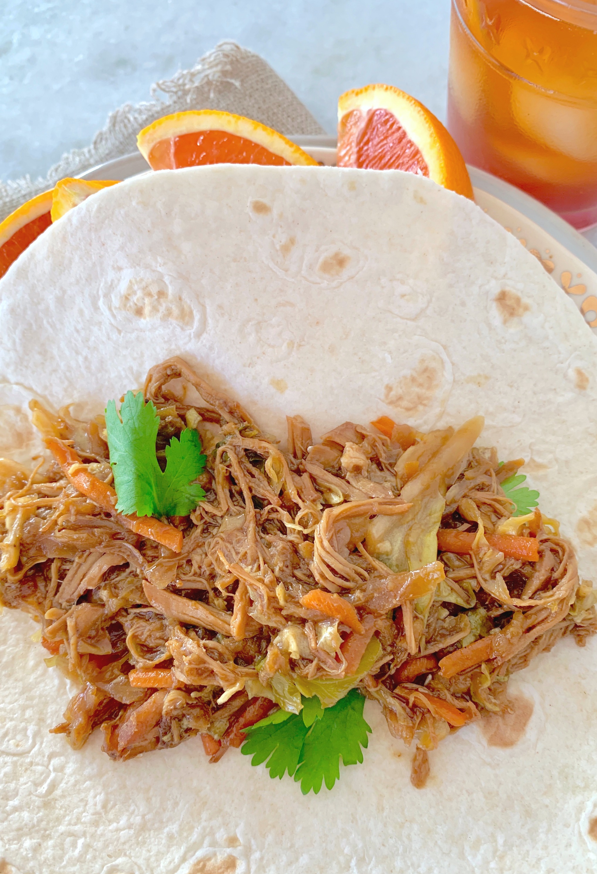 slow cooker moo shu pork on a tortilla