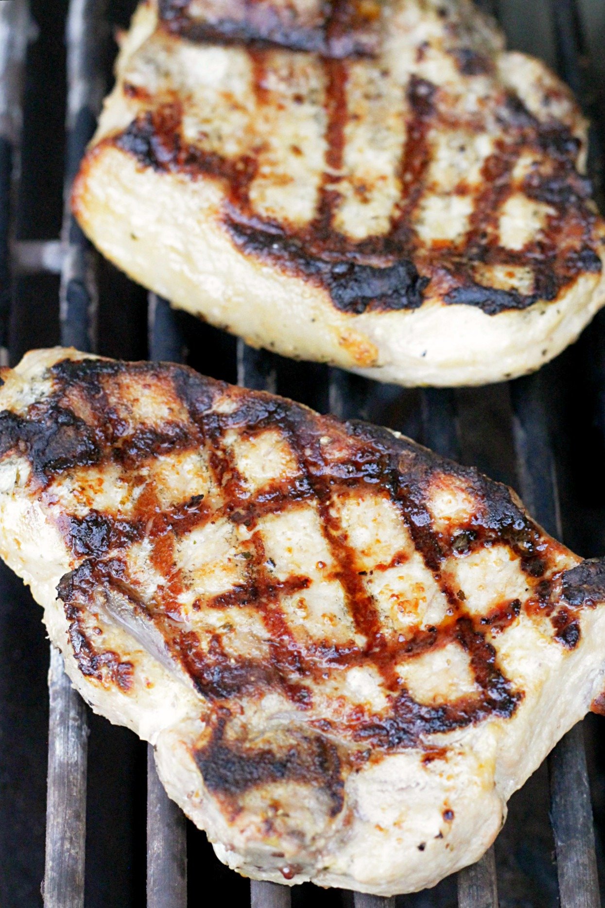 perfectly grilled pork chops on the grill