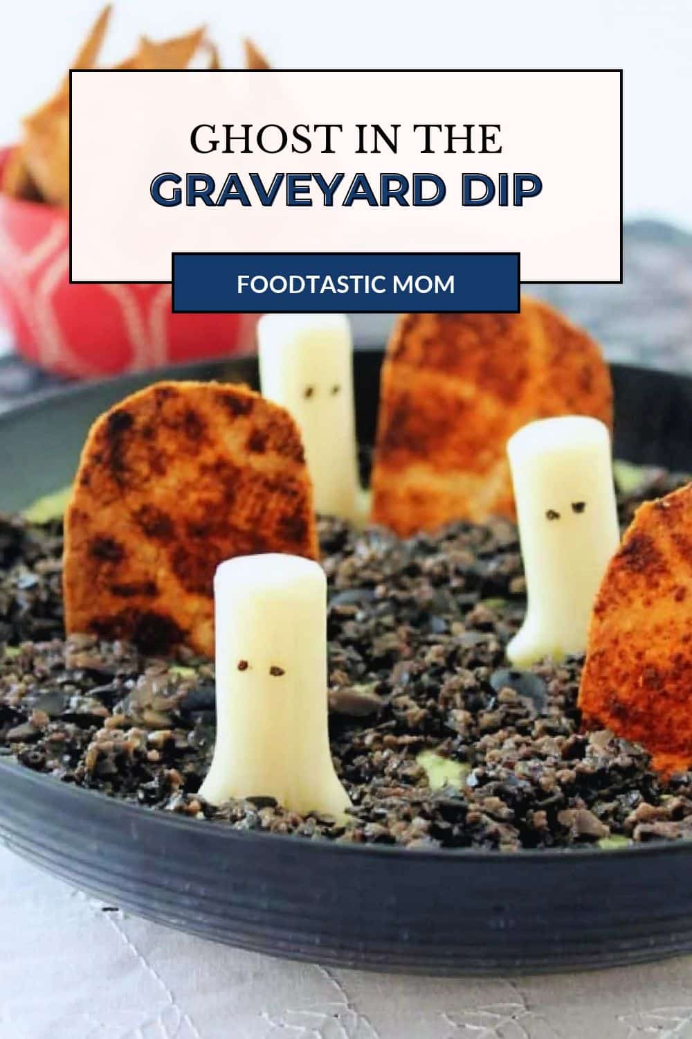Halloween Dip is based on the classic 'ghost in the graveyard' game. Homemade bean dip is topped with black olive "dirt" and string cheese "ghosts". via @foodtasticmom