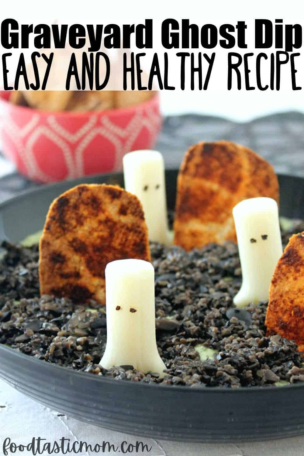 Ghost in the Graveyard Dip is a simple white bean and parsley hummus topped with finely chopped black olive. Mozzarella sting cheese ghosts and quick baked tortillas cut in the shape of grave stones make this a festive and healthy treat for ghosts and goblins of any age! via @foodtasticmom