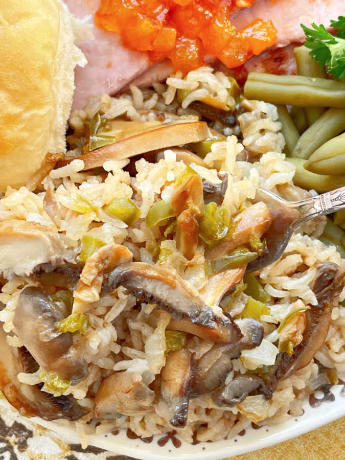 close up of a serving of rice pilaf on a dinner plate