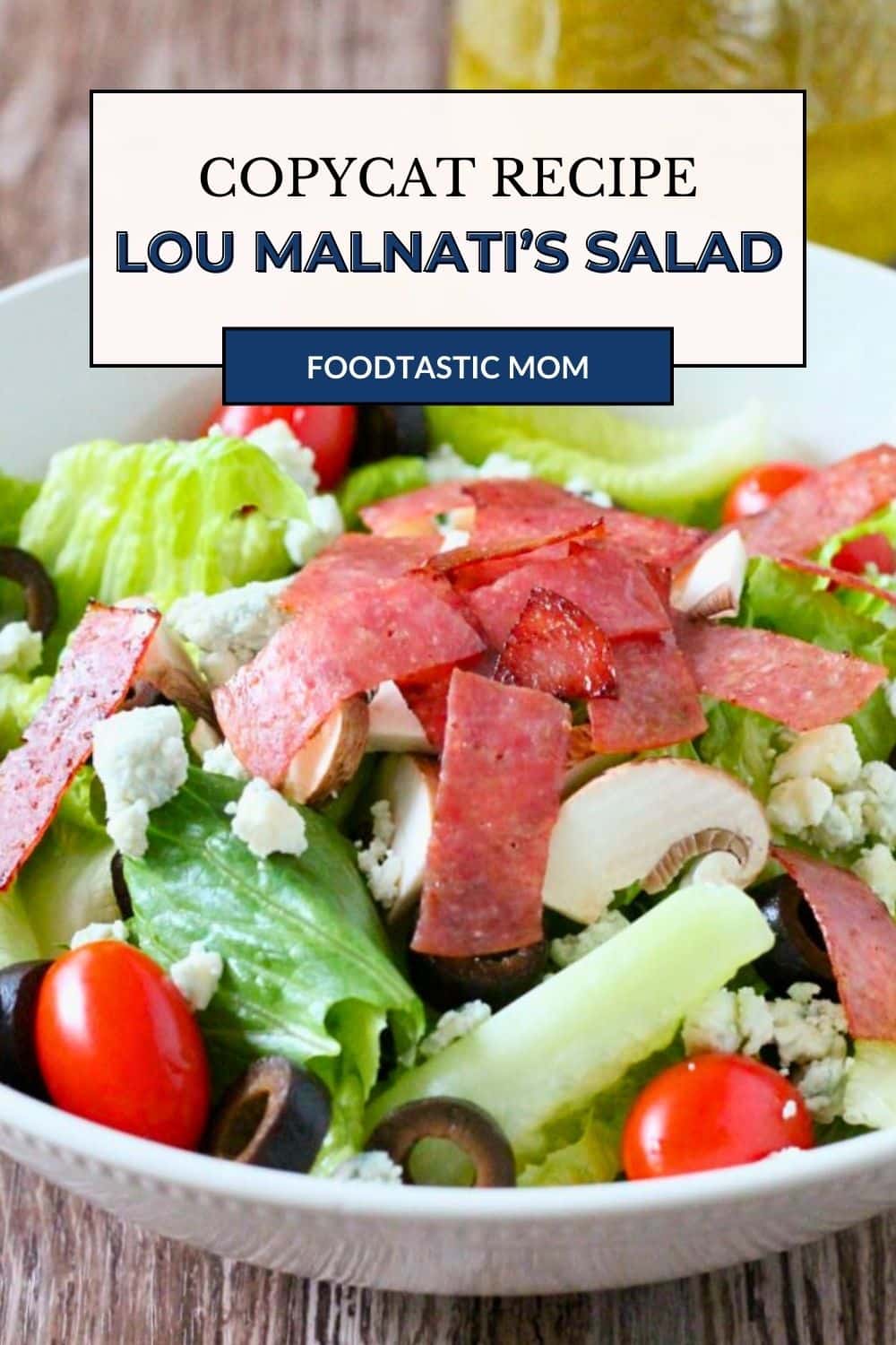 This copycat Lou Malnati's salad will help take you on a virtual trip to Chicago. Sweet Italian dressing tops romaine, tomatoes, mushrooms and black olives - the crispy salami helps to really make this a stand-out salad. via @foodtasticmom