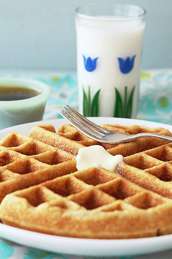 whole grain waffle on plate with glass of milk