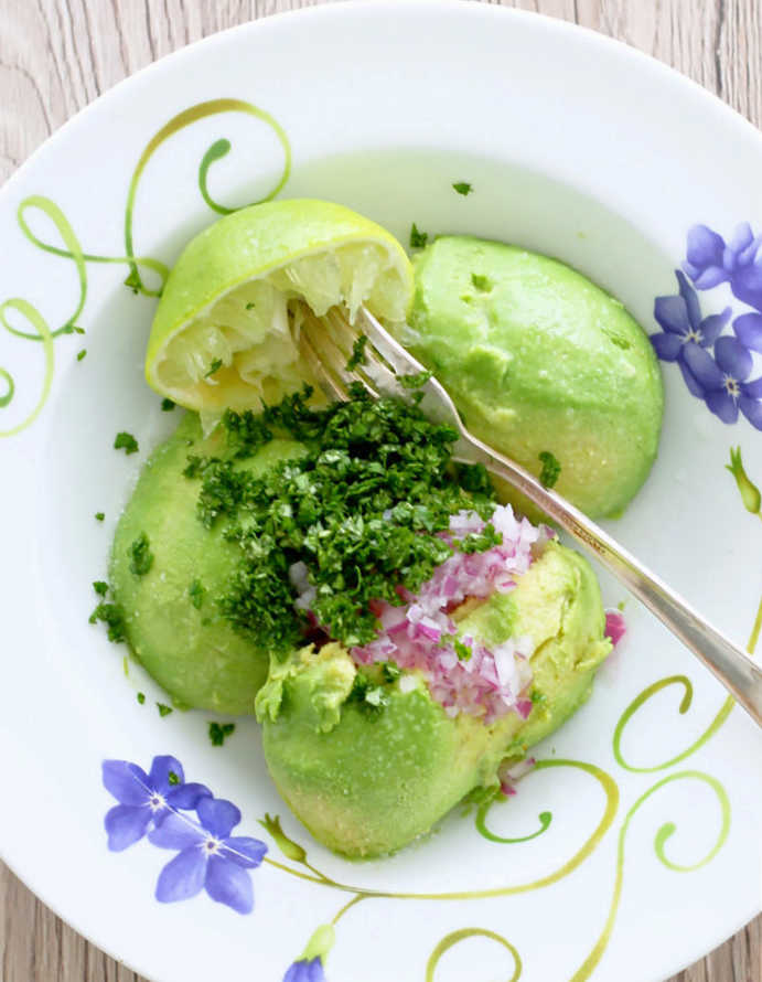 showing preserved avocados in a bowl ready to make guacamole