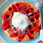 buttermilk belgian waffle topped with homemade strawberry sauce and cream cheese topping