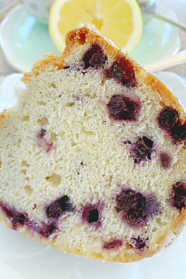 close up of slice of blueberry bundt cake