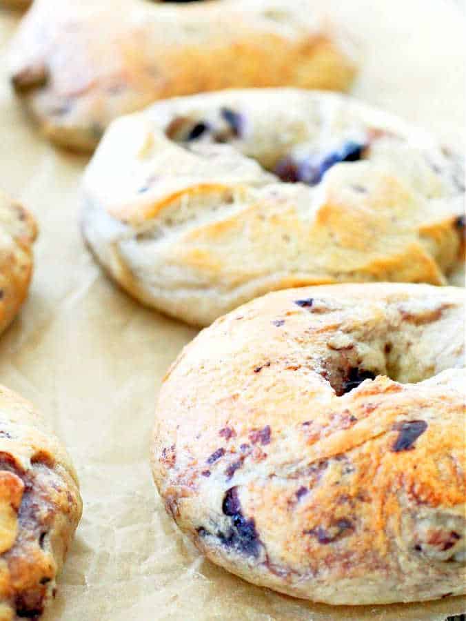 side view of freshly baked blueberry bagels