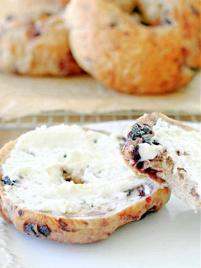 toasted blueberry bagel spread with cream cheese