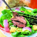 plated steak salad with pineapple vinaigrette dressing