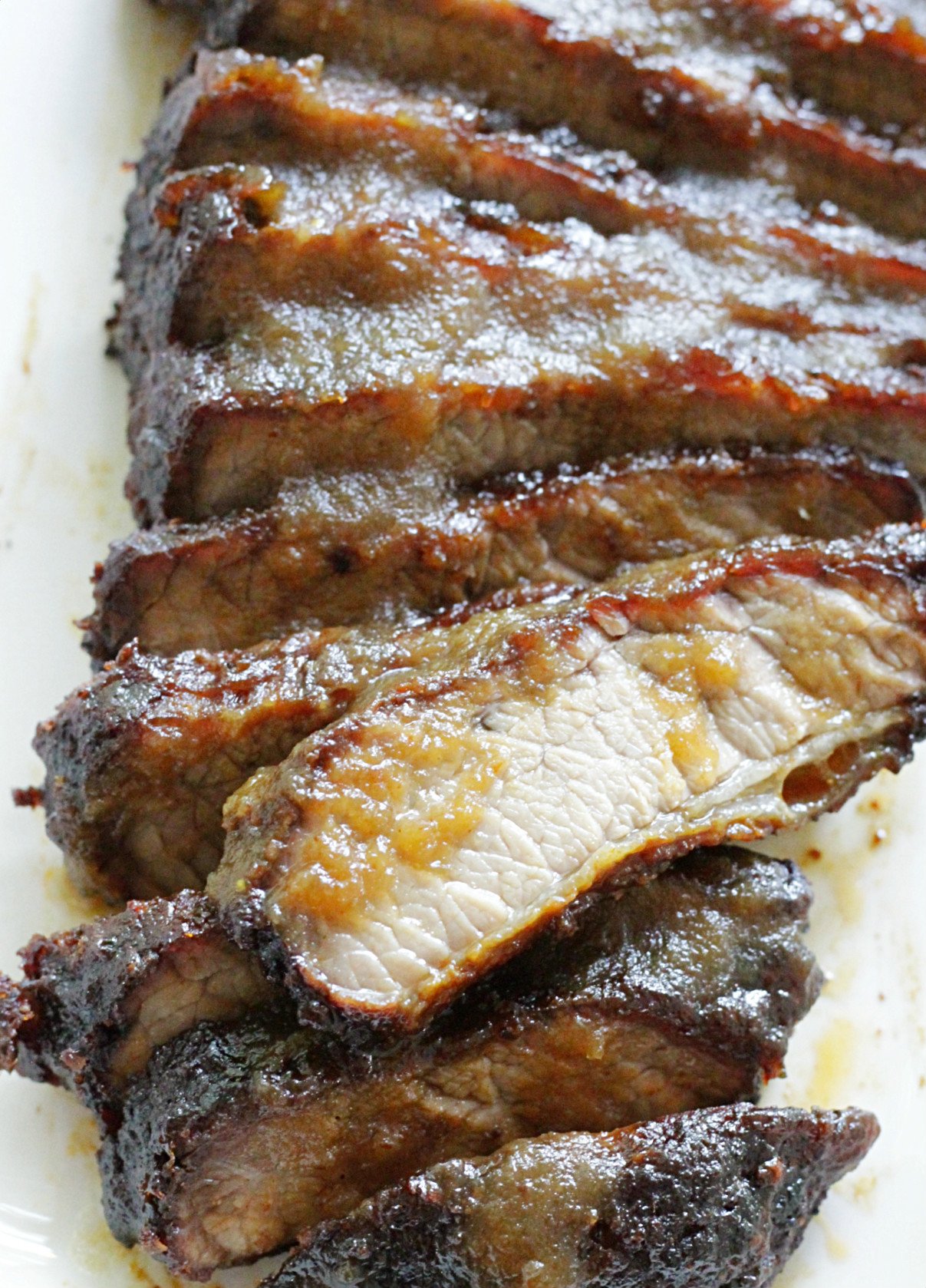 sliced brisket basted with apple butter barbecue sauce