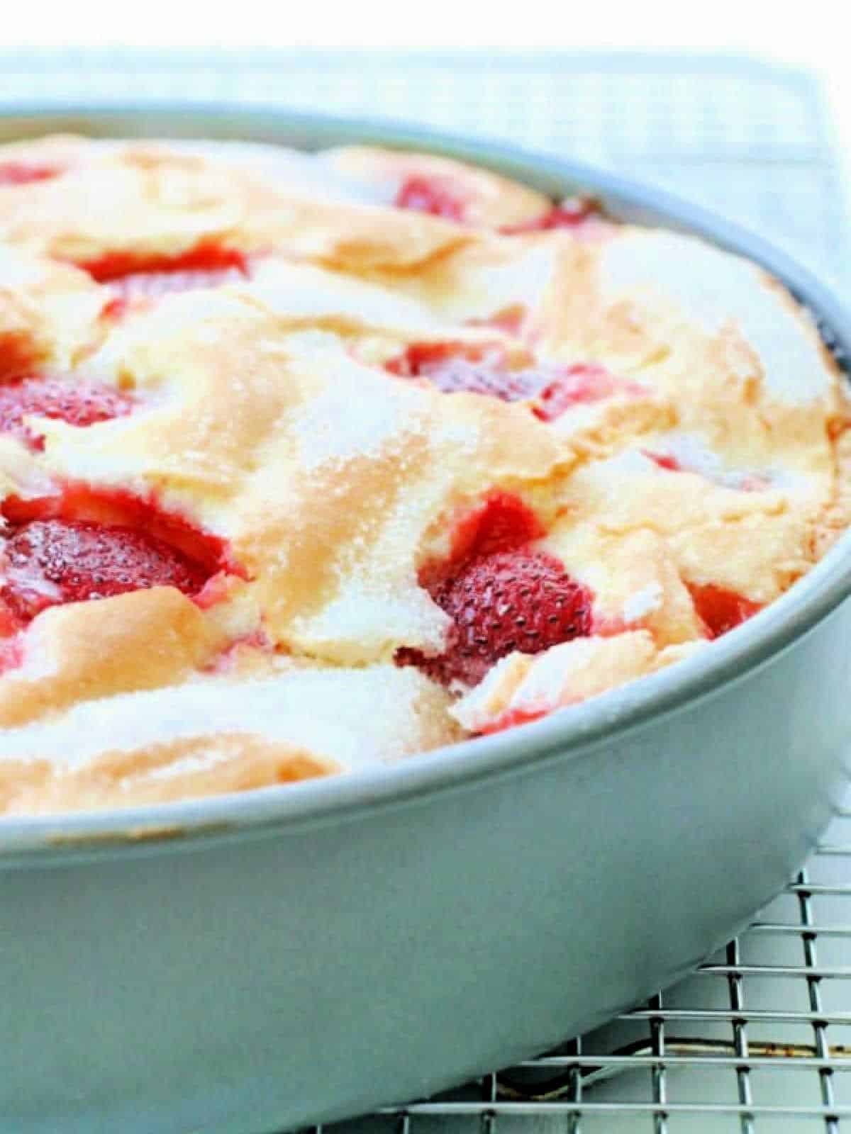 a side view of freshly baked french strawberry cake in the pan