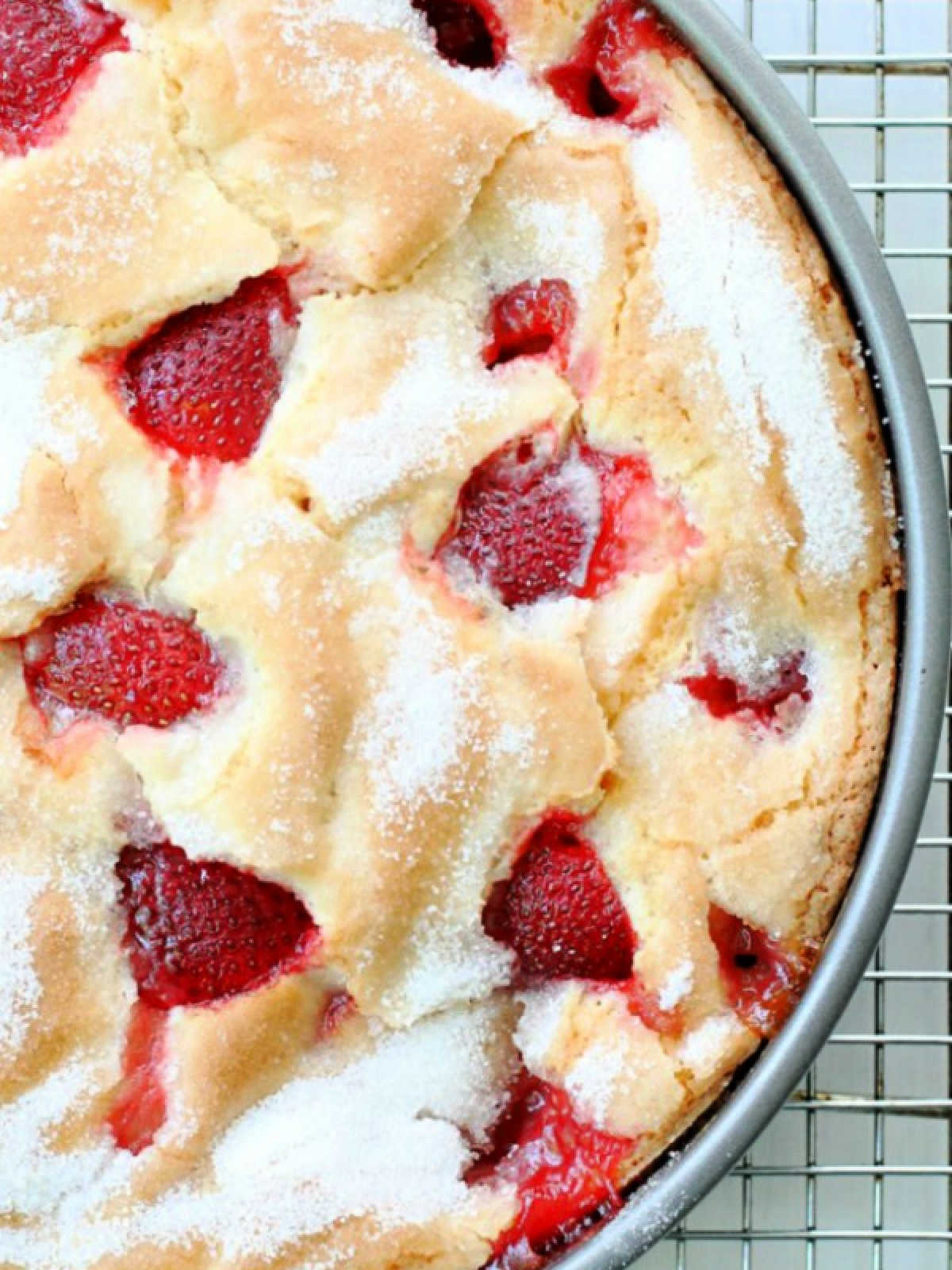 top view of a freshly baked french strawberry cake in its 9-inch baking pan