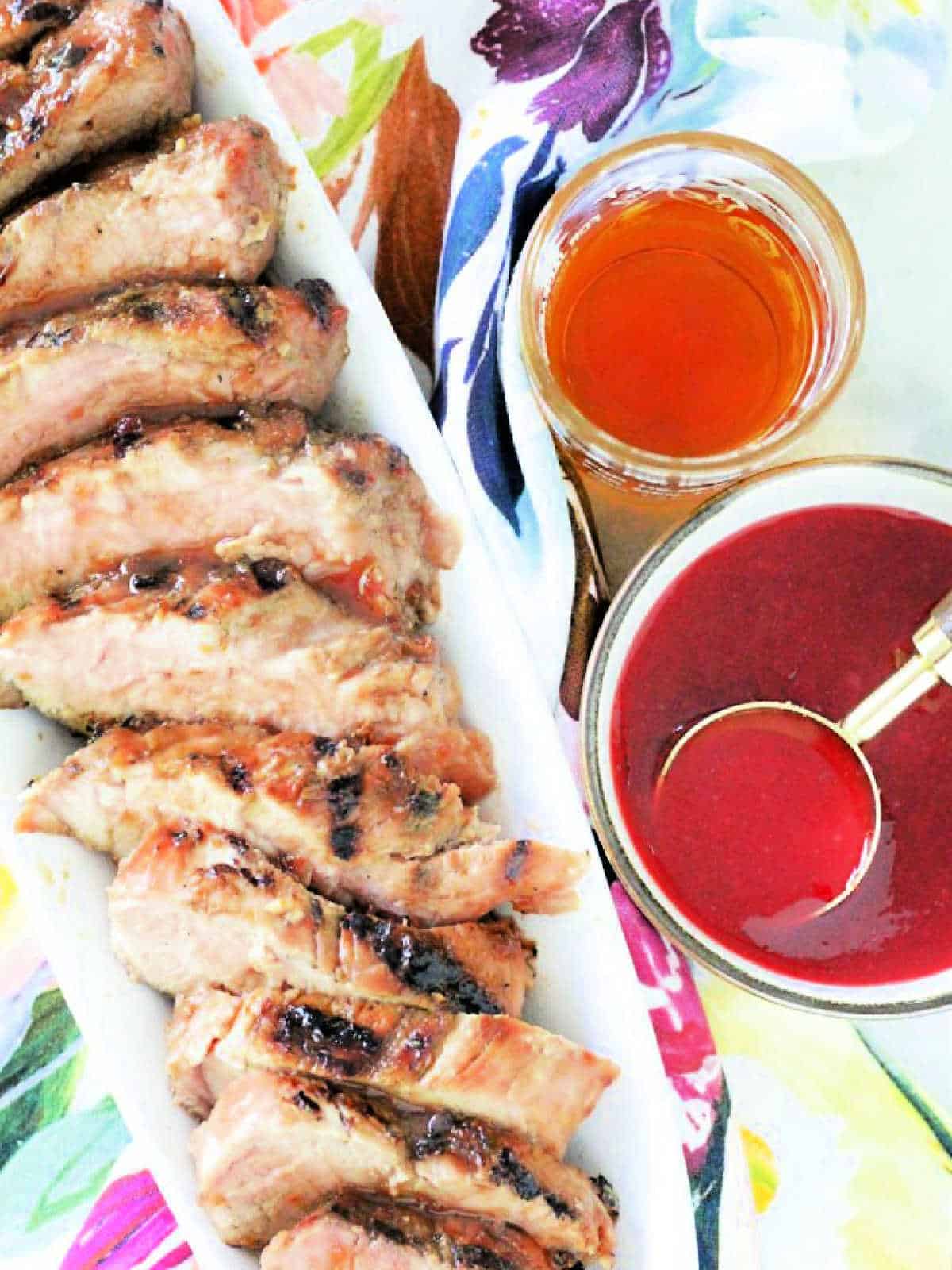 overhead view of cherry bourbon glazed pork tenderloin sliced and ready to serve
