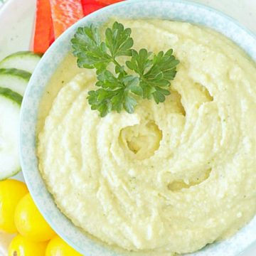 tahini free hummus in bowl with fresh vegetables