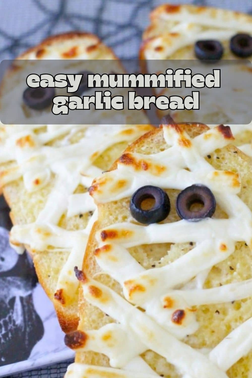 My mummified garlic bread recipe turns homemade garlic bread into a spooky side dish. With string cheese bandages and black olive eyes. via @foodtasticmom