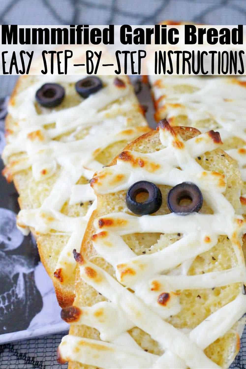 This Mummified Garlic Bread is a tasty and super simple way to dress up your dinner table for Halloween. via @foodtasticmom