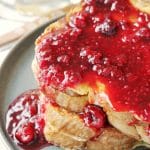 Stuffed French Toast has sweet cream cheese filling between slices of brioche and is topped with homemade raspberry syrup. It's perfect for Christmas morning breakfast!