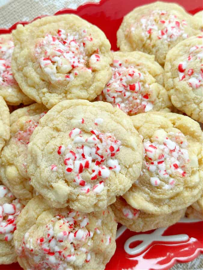 white chocolate peppermint cookies plated on a red and white christmas plate