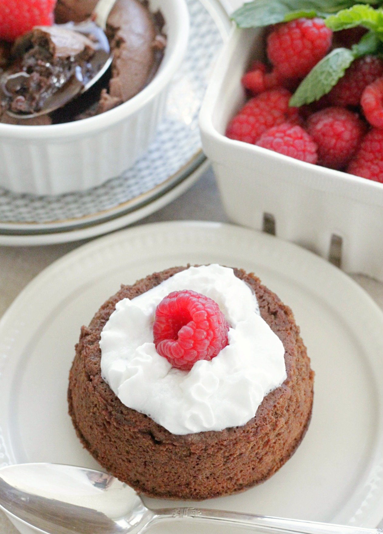 lava cake with whipped cream and raspberry top view