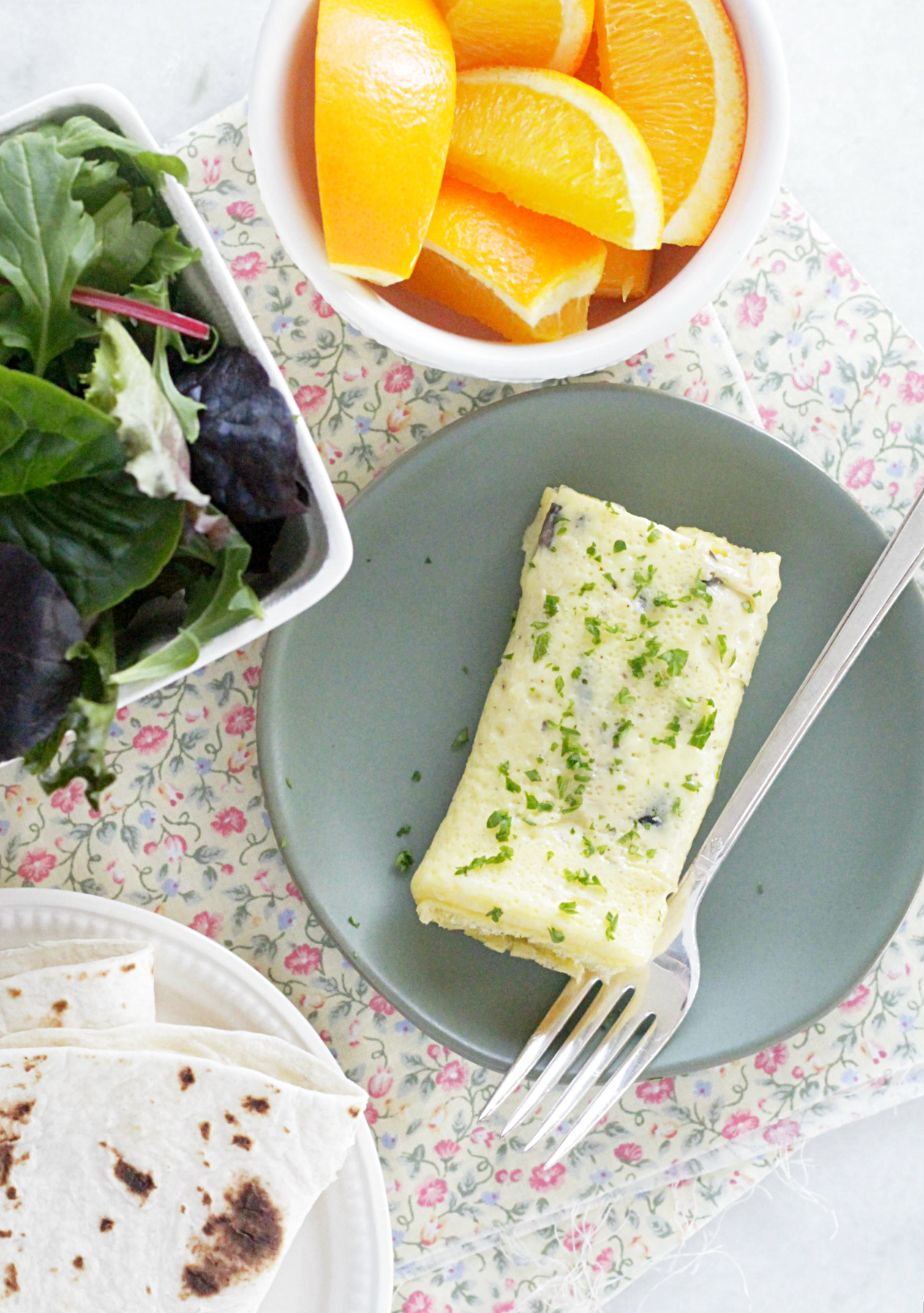 sheet pan omelettes with greens, tortilla and oranges