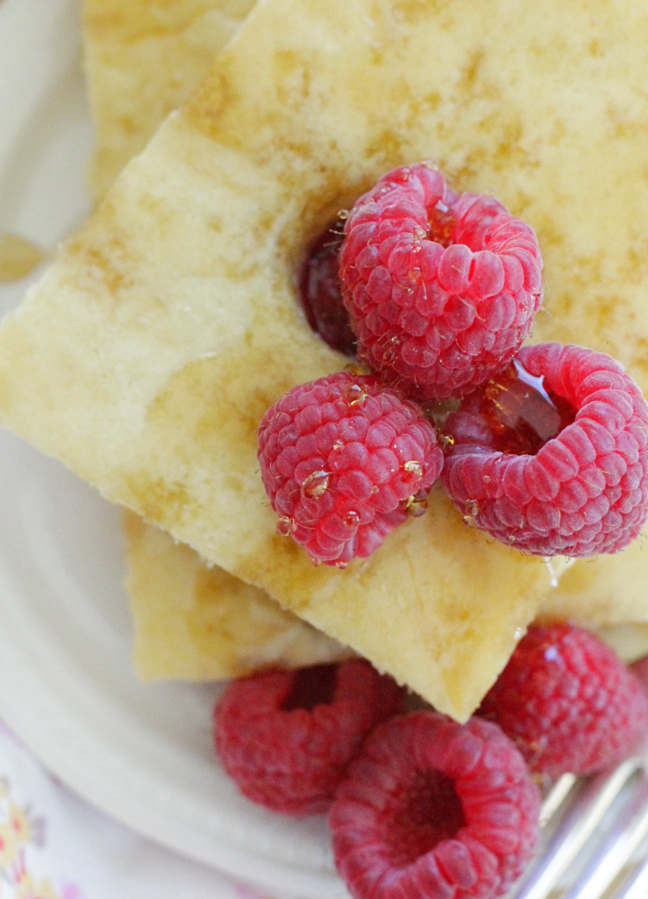 sheet pan pancakes and raspberries close up