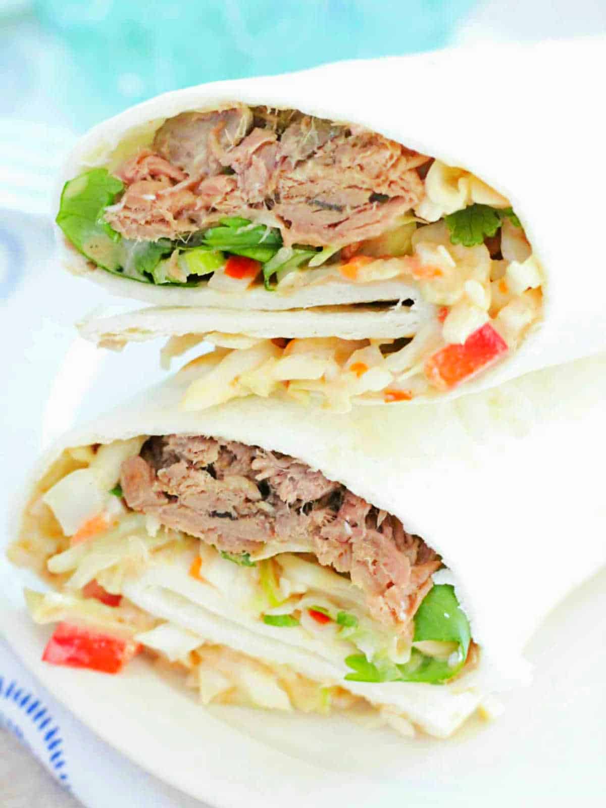 plated shredded beef wrap with creamy hoisin sauce
