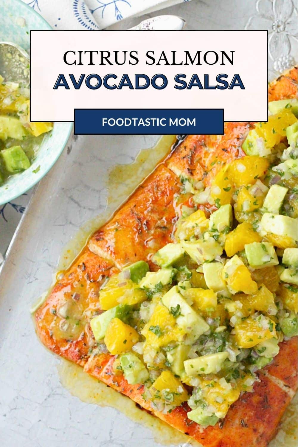 Citrus Salmon with Avocado Salsa is a light but filling meal that even novices at cooking fish can feel comfortable making at home. Dry rubbed salmon is baked on a sheet pan in the oven and topped with a fresh salsa made of avocado and oranges. via @foodtasticmom