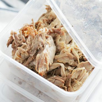 slow cooked pork portioned into individual meal prep containers