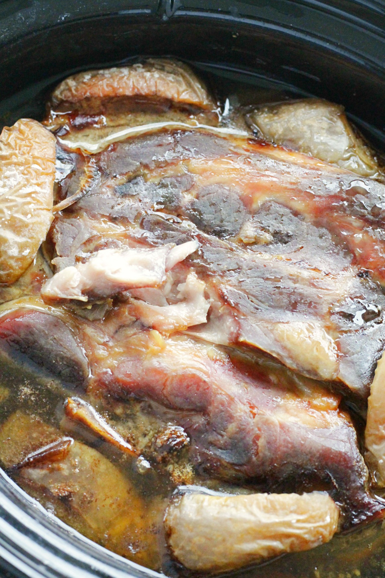 whole pork butt after being slow cooked in the slow cooker