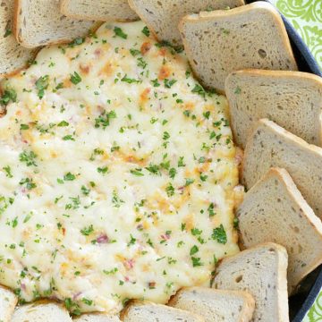 utlimate reuben dip in skillet with rye bread squares