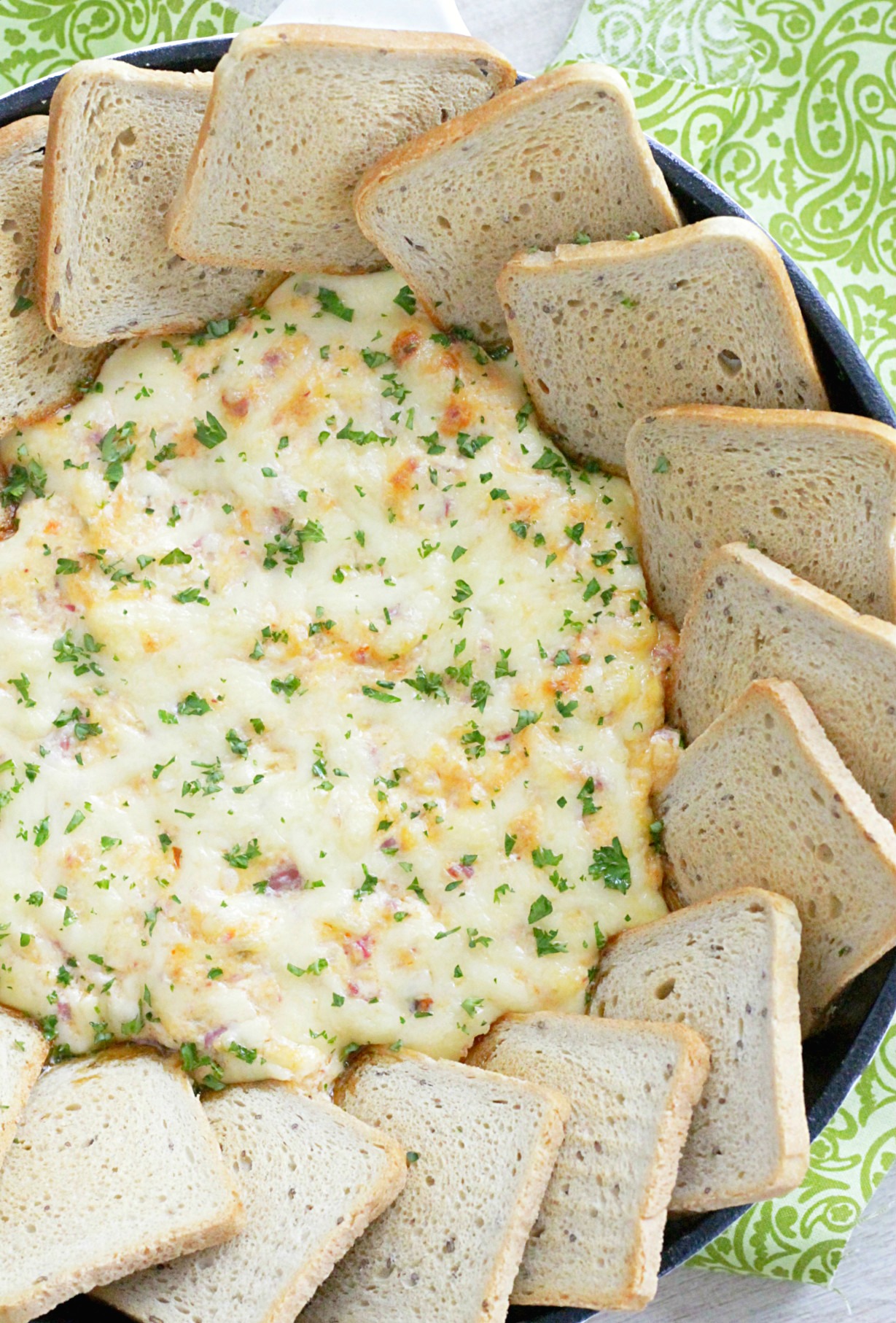 utlimate reuben dip in skillet with rye bread squares