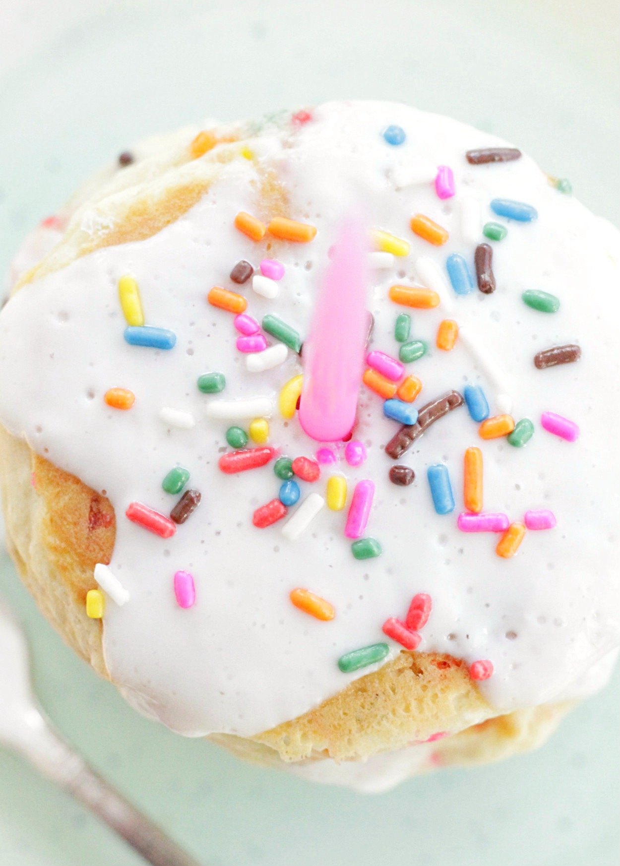 birthday cake pancakes top view close up with pink candle