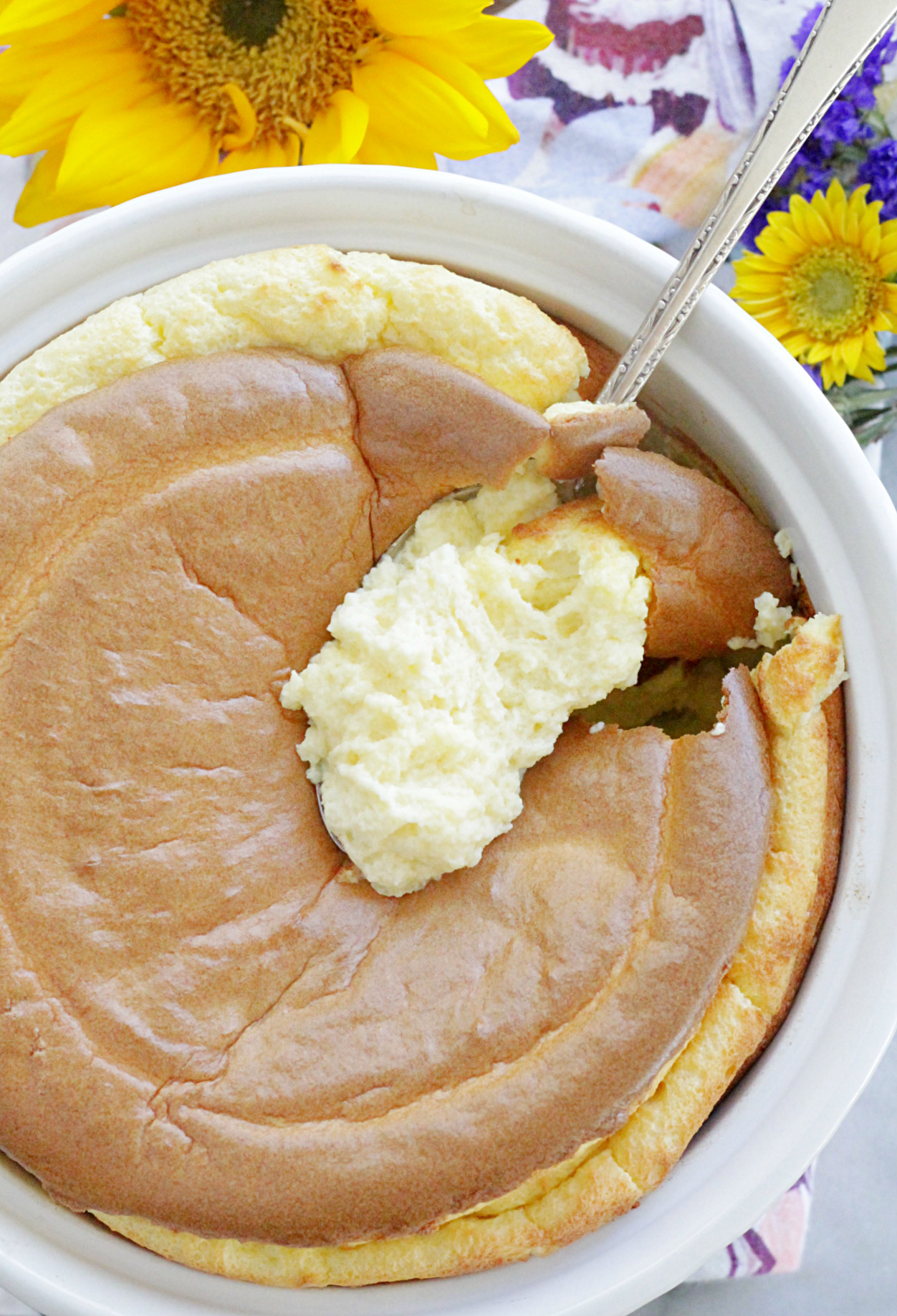 top view of classic cheese soufflé with spoon