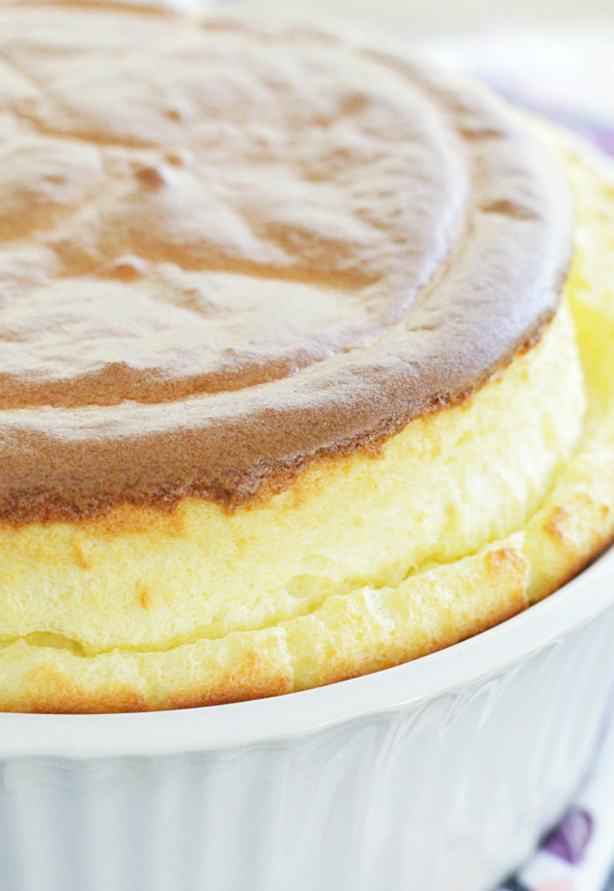 close up of classic cheese soufflé showing crown