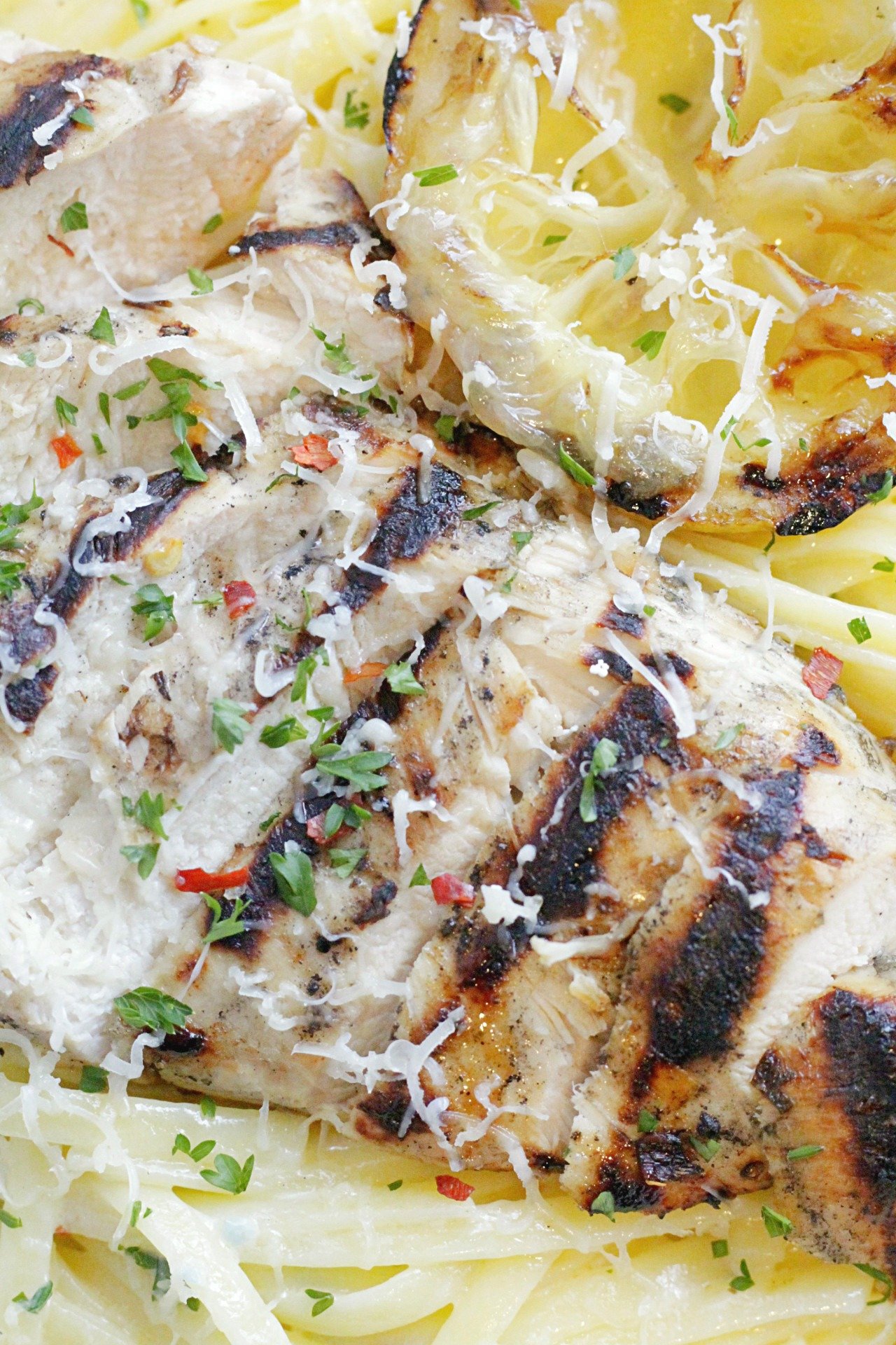 close up of grilled lemon chicken alfredo