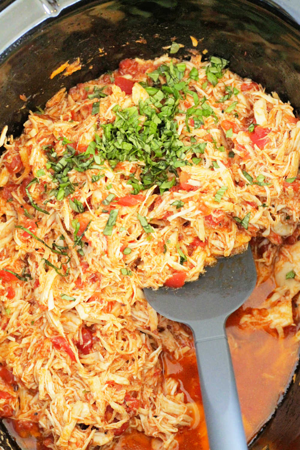 These Slow Cooker Italian Chicken Sandwiches have a fresh tomato flavor even when tomatoes aren't in season. Slow cooked Italian-flavored chicken is piled high on toasty garlic bread with melted Provolone cheese and fresh chopped basil. via @foodtasticmom