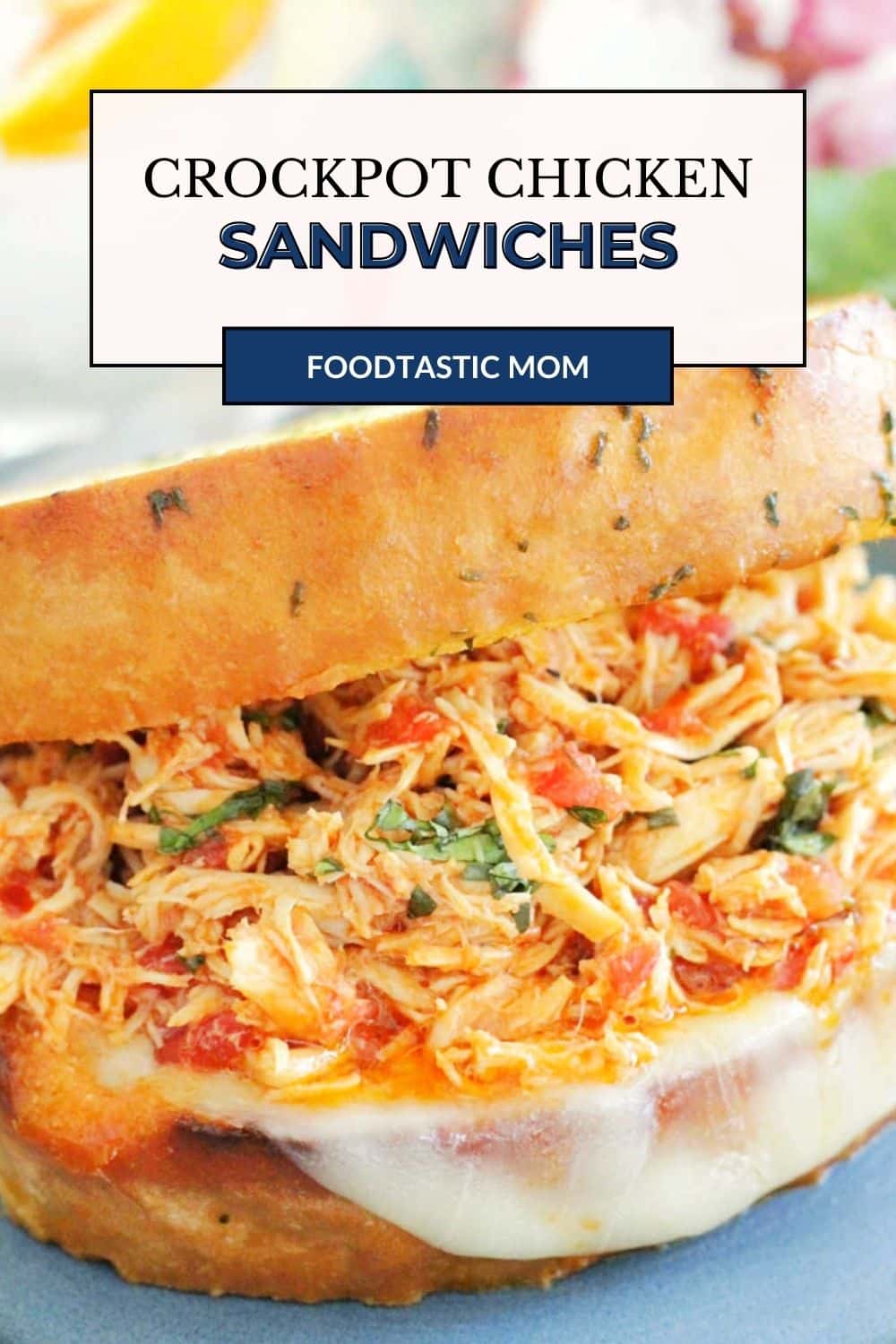 Italian crockpot chicken sandwiches are an easy dinner with big flavor. Delicious chicken piled high on toasty garlic bread. via @foodtasticmom