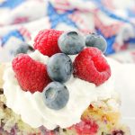 side view of slice of red white and blue berry cake