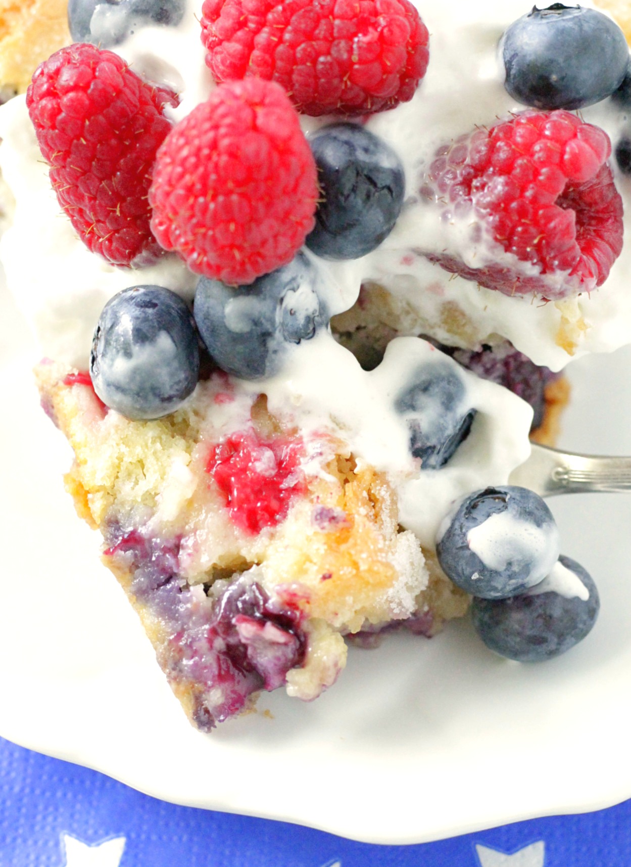 close up of red white and blue berry cake