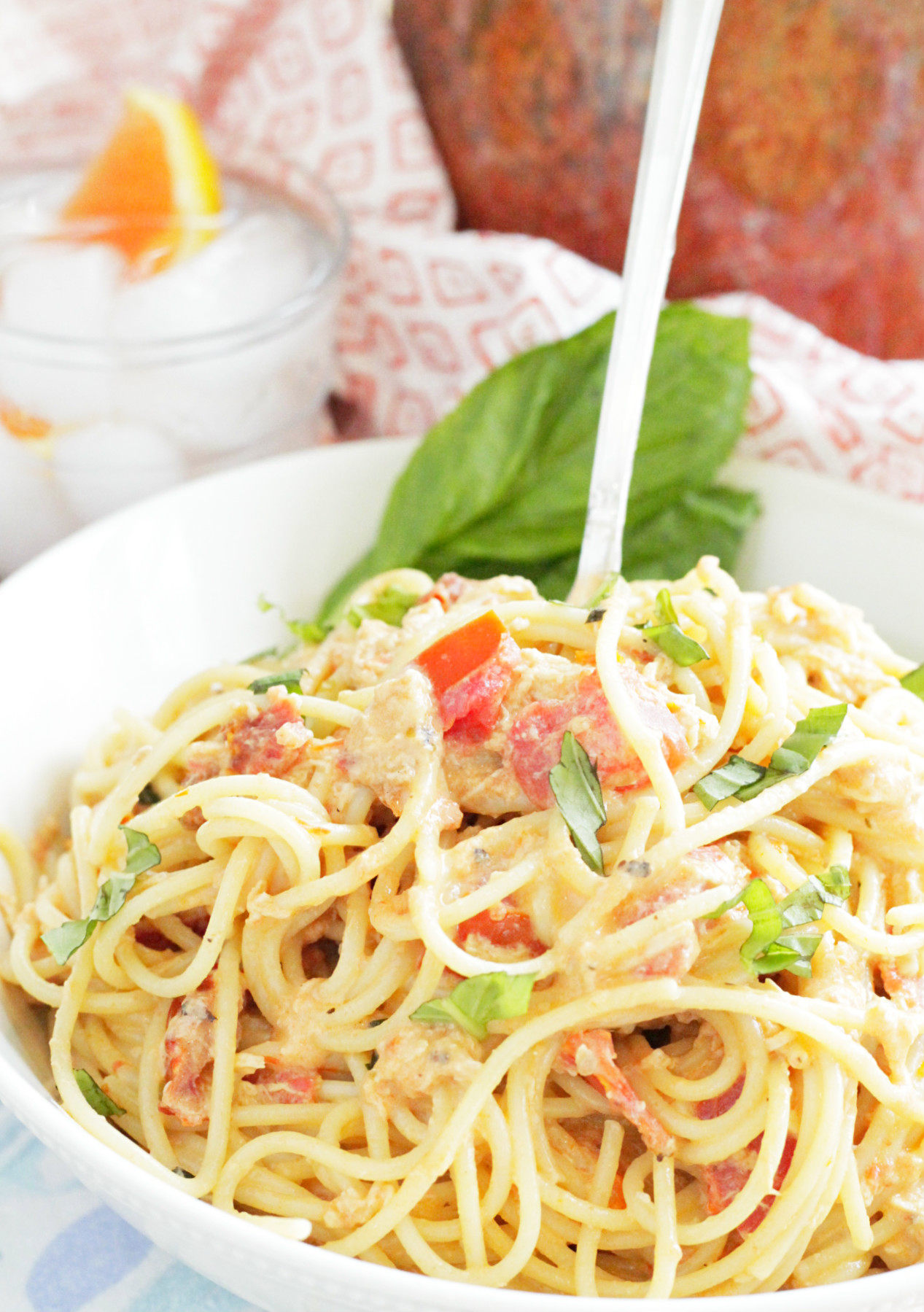 tuscan chicken pasta sauce in bowl with fork