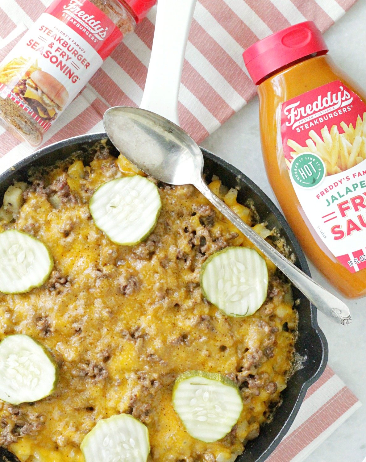 hamburger hashbrown skillet pictured with Freddy's Fry Sauce and Freddy's Seasoning